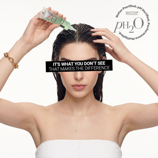 woman applying a Biotop 02 ampoule to her scalp