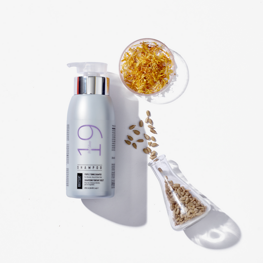 Biotop 19 pro silver shampoo bottle with a glass dish of golden seeds